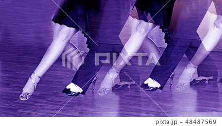 Male and female legs dancing latin rhythms 48487569