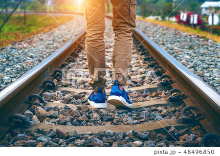 Feet of male walking on railroad. Travel concept. 48496850