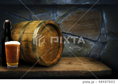 Wooden barrel and glass of beer Wooden barrel and glass of beer 48497603
