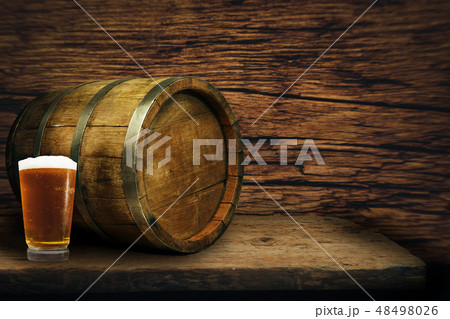 Wooden barrel and glass of beer Wooden barrel and glass of beer 48498026