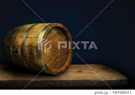 Wooden barrel and worn old table of wood. Wooden barrel and worn old table of wood. 48498041
