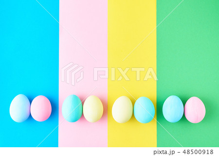 Eggs on colored striped background, top view Eggs on colored striped background, top view 48500918