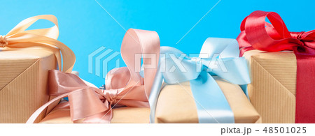 Gift boxes with red bow on blue background, banner Gift boxes with red bow on blue background, banner 48501025