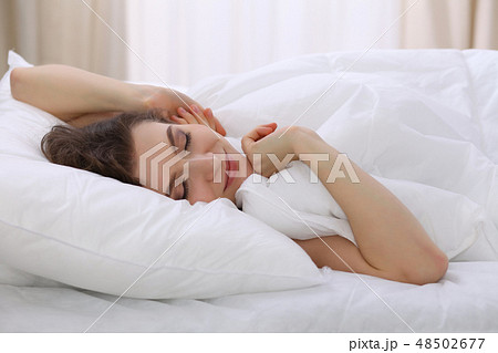 Beautiful young woman sleeping while lying in her bed. Concept of pleasant and rest reinstatement 48502677