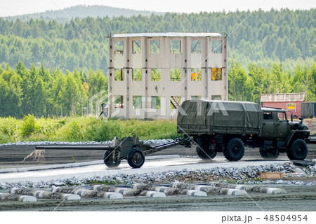 army truck transports gun after water ford 48504954