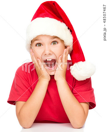 Little girl is holding her face in astonishment Little girl is holding her face in astonishment 48507467