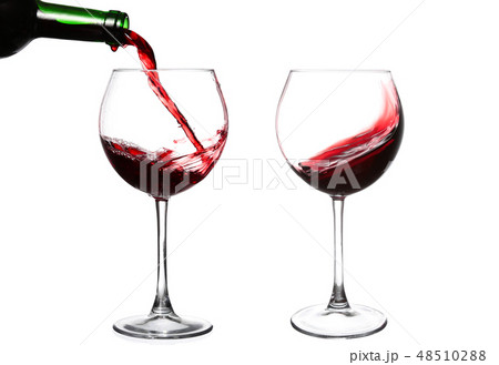 Red wine pouring on white background 48510288