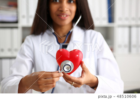 Beautiful black smiling female doctor hold 48510606