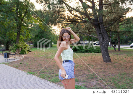 Young stylish cute girl is listening to music 48511024