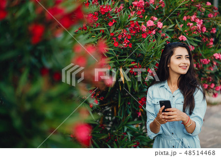 girl near flowers girl near flowers 48514468