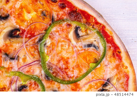 Fragment of pizza with champignons and pepper Fragment of pizza with champignons and pepper 48514474