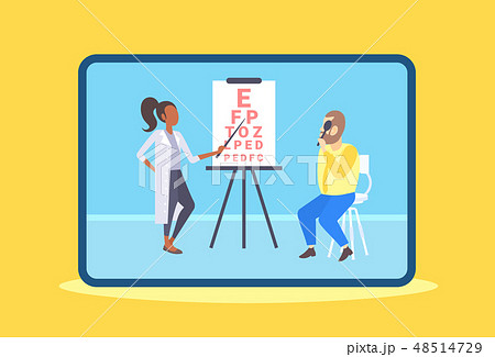 female ophthalmologist checking male patient eyesight doctor in uniform pointing letters at eye 48514729