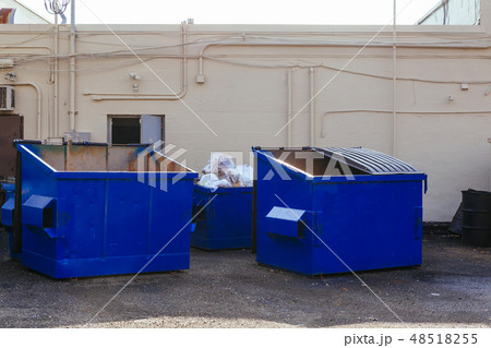 Dumpsters being full with garbage Dumpsters being full with garbage 48518255