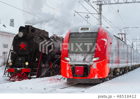 steam locomotive and modern multiple-unit train 48518412