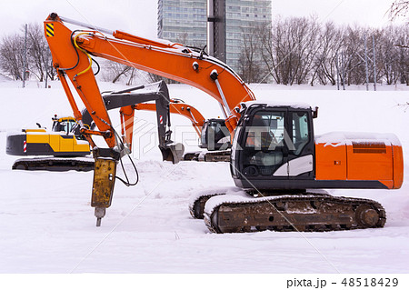 excavators on a winter building site 48518429