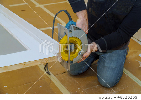 Man hands holding circular saw and preparing Man hands holding circular saw and preparing 48520209