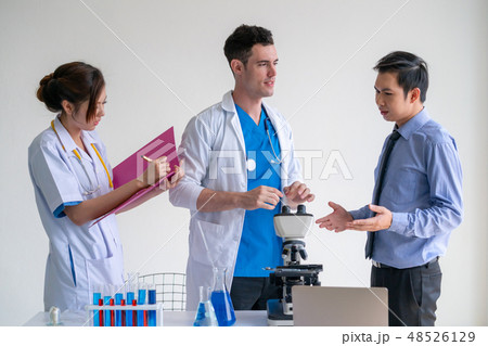 Group of scientists working in chemical lab. Group of scientists working in chemical lab. 48526129