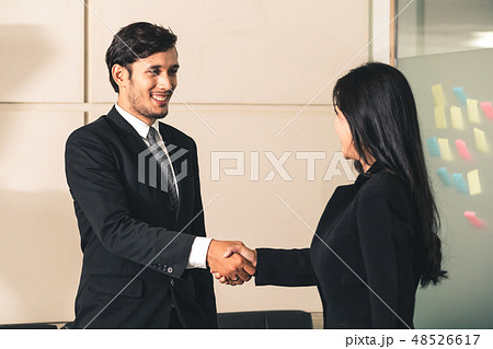 Business people handshake agreement in office. 48526617