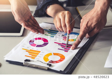 Business people working with business report. Business people working with business report. 48526623