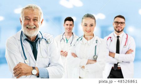 Doctor working in hospital with other doctors. Doctor working in hospital with other doctors. 48526861