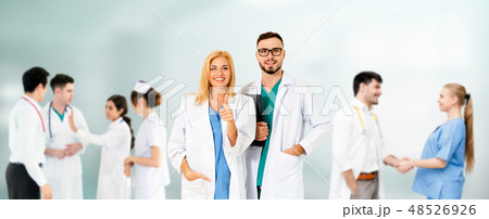 Doctor working in hospital with other doctors. 48526926