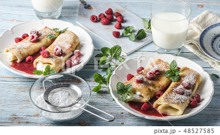 Cheese blintzes pancakes with fresh fruit Cheese blintzes pancakes with fresh fruit 48527585