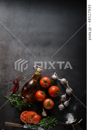 Homemade olive oil with tomatoes and chilli 48527935