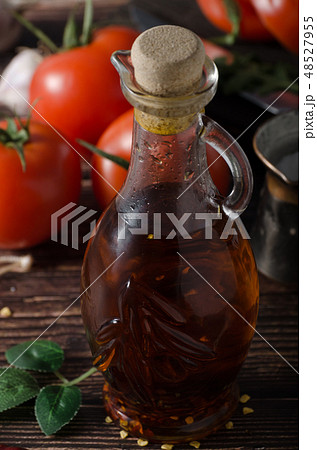 Homemade olive oil with tomatoes and chilli Homemade olive oil with tomatoes and chilli 48527955