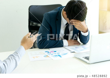 businessmans sit quarrel at the table fill sad 48528892