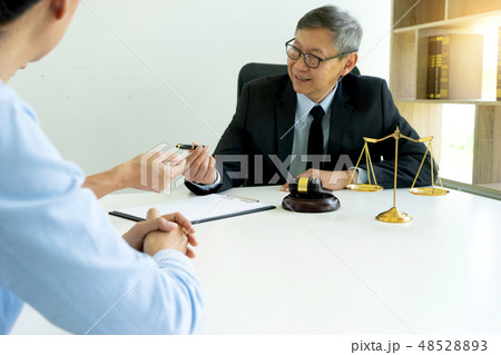 Judge work at the table talk with wife husband 48528893