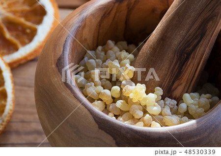 Closeup of frankincense resin in a mortar 48530339