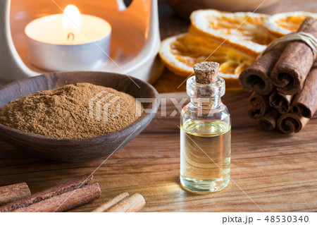 A bottle of cinnamon essential oil 48530340