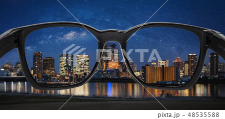 looking city at night through glasses looking city at night through glasses 48535588