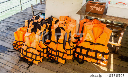 Group of life jacket on boat with tip box 48536593