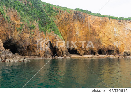 Cave on cliff island and sea 48536615