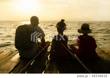 Silhouette of Single dad and daughter sit on raft 48536616