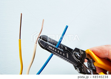 Using  wire stripper cutter. 48540238