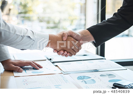 Finishing up a conversation after collaboration, handshake of tw 48540839