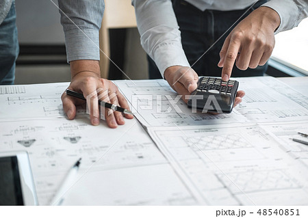 Team of engineering or architect meeting and discussing on bluep Team of engineering or architect meeting and discussing on bluep 48540851