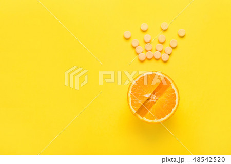 Concept of healthy eating, supplement. Vitamin C is main vitamin, the king among vitamins. Flat lay Concept of healthy eating, supplement. Vitamin C is main vitamin, the king among vitamins. Flat lay 48542520