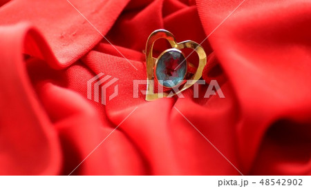 Diamond Ring On Red Satin Diamond Ring On Red Satin 48542902