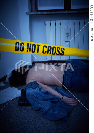 victim lying on the floor - crime scene 48543455