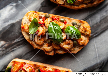 Traditional Italian bruschettas Traditional Italian bruschettas 48544875
