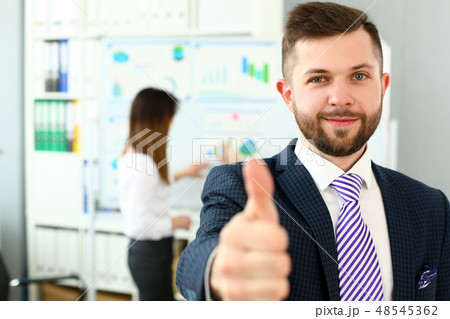 Male arm show OK or confirm during conference in office Male arm show OK or confirm during conference in office 48545362