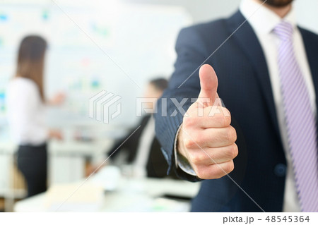 Male arm show OK or confirm during conference in office Male arm show OK or confirm during conference in office 48545364