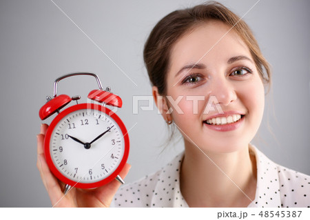 Adult smiling caucasian woman hold red Adult smiling caucasian woman hold red 48545387