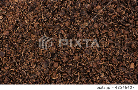 Grated chocolate texture. Ground chocolate background Grated chocolate texture. Ground chocolate background 48546407