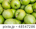 green apples in a wooden box 48547286