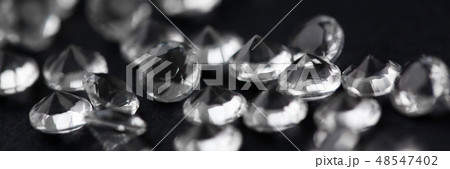 Scattering of white star diamonds on black Scattering of white star diamonds on black 48547402