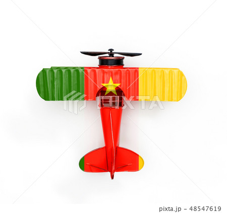 Flag of Cameroon travel Metal toy plane on white Flag of Cameroon travel Metal toy plane on white 48547619